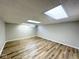 Spacious finished basement with updated flooring and a small window at 6811 S Meridian St, Indianapolis, IN 46217