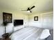 Bright bedroom with a ceiling fan, and neutral-toned decor at 6811 S Meridian St, Indianapolis, IN 46217