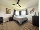 Comfortable bedroom featuring wood-look floors, and contemporary decor at 6811 S Meridian St, Indianapolis, IN 46217