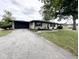 Charming single-story home features a spacious yard, attached garage, and lovely landscaping at 6811 S Meridian St, Indianapolis, IN 46217