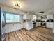 Bright kitchen features white cabinets, stainless steel appliances, and modern light fixtures at 6811 S Meridian St, Indianapolis, IN 46217