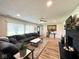 Spacious living room includes modern décor, a decorative fireplace, and wood flooring at 6811 S Meridian St, Indianapolis, IN 46217