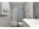 Bright bathroom with tiled shower and white vanity at 6814 Summer Time Dr, Indianapolis, IN 46226