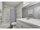 Bright bathroom with tiled shower and white vanity at 6814 Summer Time Dr, Indianapolis, IN 46226