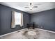 Comfortable bedroom featuring a window and fan at 6814 Summer Time Dr, Indianapolis, IN 46226