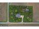 Aerial view showcases the blue home on a large lot, featuring a long driveway and outbuilding at 7020 N 375 E, Lebanon, IN 46052