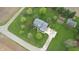 Overhead view of a charming blue home with a spacious yard and well-maintained landscaping at 7020 N 375 E, Lebanon, IN 46052