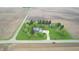 Wide aerial shot showcasing a blue home on an expansive lot surrounded by farmland at 7020 N 375 E, Lebanon, IN 46052