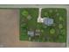 Overhead view of a blue home with an outbuilding, garden and sprawling green lawn at 7020 N 375 E, Lebanon, IN 46052