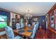 Elegant dining room with a large wooden table, chandelier, and classic decor at 7020 N 375 E, Lebanon, IN 46052