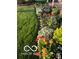 Beautifully landscaped flower bed with a variety of colorful flowers and lush greenery at 7020 N 375 E, Lebanon, IN 46052