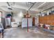 Spacious garage with built-in cabinets and a refrigerator, providing ample storage and functionality at 7020 N 375 E, Lebanon, IN 46052