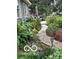 Beautiful landscaping features a brick path winding through lush greenery and colorful flowers at 7020 N 375 E, Lebanon, IN 46052