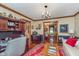 Open living space with hardwood floors, a desk area, and a view into the dining room at 7020 N 375 E, Lebanon, IN 46052