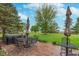Relaxing brick patio with outdoor dining set and hot tub overlooking a lush green lawn at 7020 N 375 E, Lebanon, IN 46052