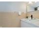 Bathroom with modern vessel sink and vanity with sleek fixtures at 7404 Countrybrook Dr, Indianapolis, IN 46260