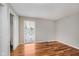 Bedroom with hardwood flooring features a large window at 7404 Countrybrook Dr, Indianapolis, IN 46260