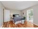Bedroom with hardwood flooring and large window offers plenty of natural light at 7404 Countrybrook Dr, Indianapolis, IN 46260