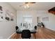 Inviting dining area with hardwood floors and views into the living room at 7404 Countrybrook Dr, Indianapolis, IN 46260