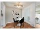 Well-lit dining room with hardwood floors and a stylish glass table set at 7404 Countrybrook Dr, Indianapolis, IN 46260