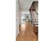 Inviting living space with hardwood floors and staircase at 7404 Countrybrook Dr, Indianapolis, IN 46260