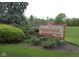 Community sign for Countrybrook Condominiums North surrounded by lush landscaping at 7404 Countrybrook Dr, Indianapolis, IN 46260