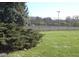 Community tennis courts surrounded by trees and grassy areas at 7404 Countrybrook Dr, Indianapolis, IN 46260