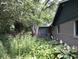 Lush backyard with green landscaping at 8728 Holliday Dr, Indianapolis, IN 46260