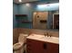 Updated bathroom featuring stylish vanity, modern sink, toilet and framed mirror at 8728 Holliday Dr, Indianapolis, IN 46260