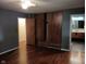 Bedroom with entry to ensuite bathroom and built-in wardrobe with sliding doors at 8728 Holliday Dr, Indianapolis, IN 46260