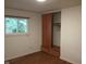 Bedroom featuring hardwood floors, a closet with sliding doors, and natural light from window at 8728 Holliday Dr, Indianapolis, IN 46260