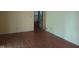 Bedroom with hardwood floors, closet and window, providing natural light at 8728 Holliday Dr, Indianapolis, IN 46260