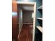 View of bedroom featuring hardwood floors and access to a closet with white shelves at 8728 Holliday Dr, Indianapolis, IN 46260