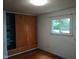 Bedroom with built-in storage and large window showing natural light at 8728 Holliday Dr, Indianapolis, IN 46260