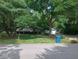 Beautiful home with lush green lawn, mature trees and landscaping at 8728 Holliday Dr, Indianapolis, IN 46260