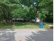 Beautiful home with lush green lawn, mature trees and landscaping at 8728 Holliday Dr, Indianapolis, IN 46260