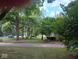 Charming home nestled among mature trees and green landscaping at 8728 Holliday Dr, Indianapolis, IN 46260