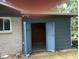 Open garage doors showing the interior, with a brick exterior at 8728 Holliday Dr, Indianapolis, IN 46260