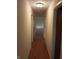 Hallway featuring hardwood floors and neutral-colored walls at 8728 Holliday Dr, Indianapolis, IN 46260