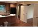 Updated kitchen with wood cabinets, breakfast bar island, and access to additional spaces at 8728 Holliday Dr, Indianapolis, IN 46260