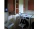 Laundry room with modern washer and dryer units and wall-mounted cabinets and sink at 8728 Holliday Dr, Indianapolis, IN 46260