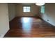 Bright living room with hardwood floors and large windows at 8728 Holliday Dr, Indianapolis, IN 46260