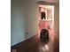 Open living room featuring hardwood floors with view into kitchen with an island at 8728 Holliday Dr, Indianapolis, IN 46260