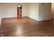 Open living space showcasing beautiful hardwood floors and neutral paint, ready for personal touches at 8728 Holliday Dr, Indianapolis, IN 46260
