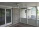 Enclosed porch with tile flooring and views of the backyard at 8728 Holliday Dr, Indianapolis, IN 46260