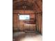 Interior of the shed featuring a workbench, window and wood walls at 8728 Holliday Dr, Indianapolis, IN 46260