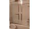 Bathroom shower with sliding glass doors and white tiled walls at 8728 Holliday Dr, Indianapolis, IN 46260