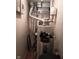 Close-up of water heater and other mechanical components in the basement at 8728 Holliday Dr, Indianapolis, IN 46260