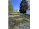 Large backyard area featuring mature trees and ample space for outdoor activities at , Indianapolis, IN 46226