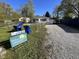 Charming single-story home with a gravel driveway and a well-maintained front lawn at , Indianapolis, IN 46226
